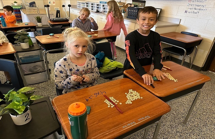 3rd grade students doing break apart arrays to help with multiplication